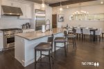High End Bright Kitchen with Bar Style Seating for 3